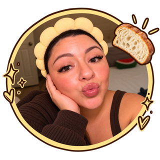 mandy in a butter-yellow headband blowing a kiss, in a doodled circle frame with a slice of bread, sparkles and hearts